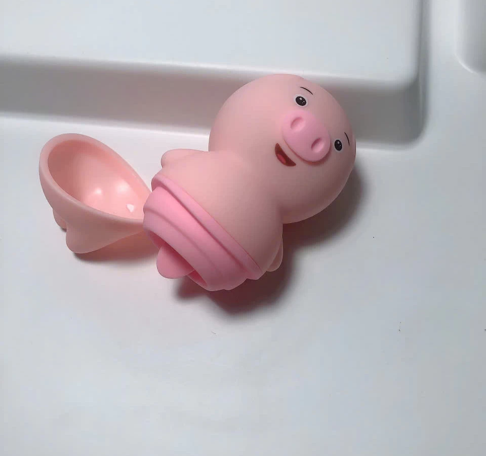 Máy liếm hạt le, đầu ti hình chú heo ngộ nghĩnh