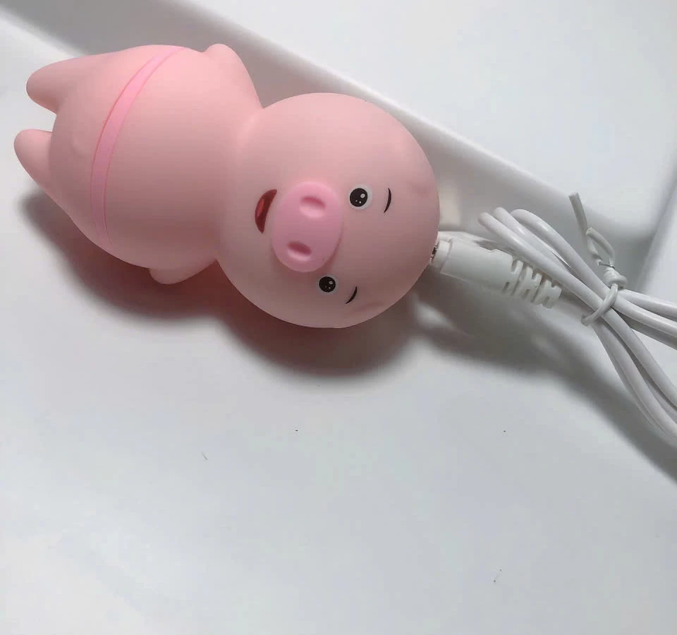 Máy liếm hạt le, đầu ti hình chú heo ngộ nghĩnh